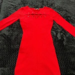 Red long sleeve knit dress with front opening. 78% Rayon 22% Polyester